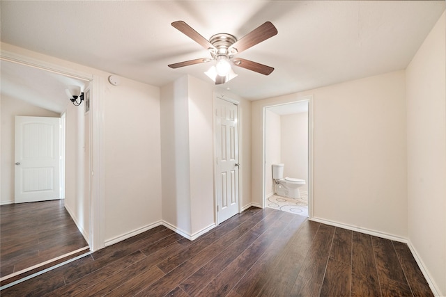 unfurnished room with a ceiling fan, baseboards, and wood finished floors