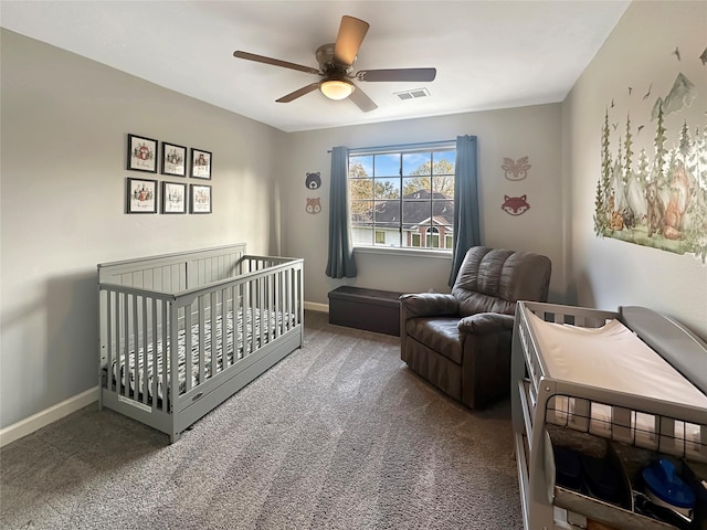 bedroom with visible vents, baseboards, carpet, and a ceiling fan