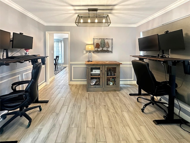 office area with a decorative wall, wainscoting, crown molding, and wood tiled floor