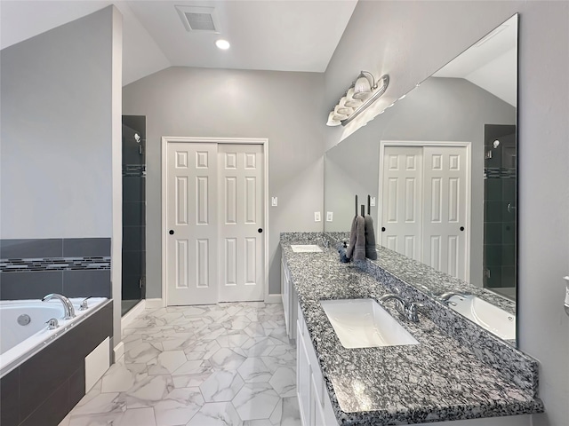 full bathroom with a stall shower, a bath, marble finish floor, and a sink