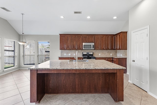 kitchen featuring a sink, visible vents, lofted ceiling, and appliances with stainless steel finishes