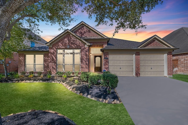 13703 Evening Wind Dr, Pearland, TX 77584 - view of front of home with brick siding, an attached garage, a front yard, and driveway