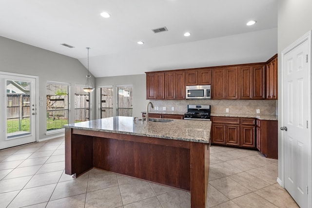 kitchen with light tile patterned flooring, visible vents, stainless steel appliances, and a sink