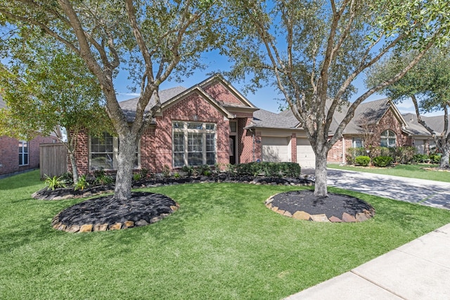 view of front of property featuring brick siding, an attached garage, concrete driveway, and a front lawn