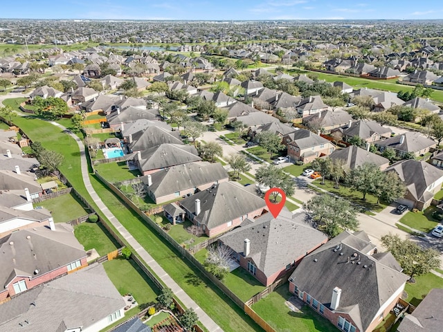 birds eye view of property with a residential view