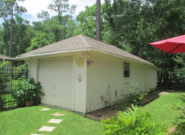 detached garage with fence