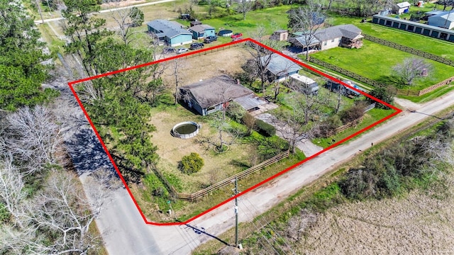 birds eye view of property featuring a rural view