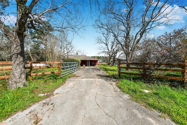 view of gate featuring a fenced front yard