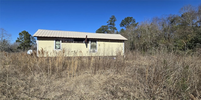 view of home's exterior with metal roof