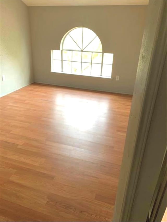 spare room with light wood-style floors