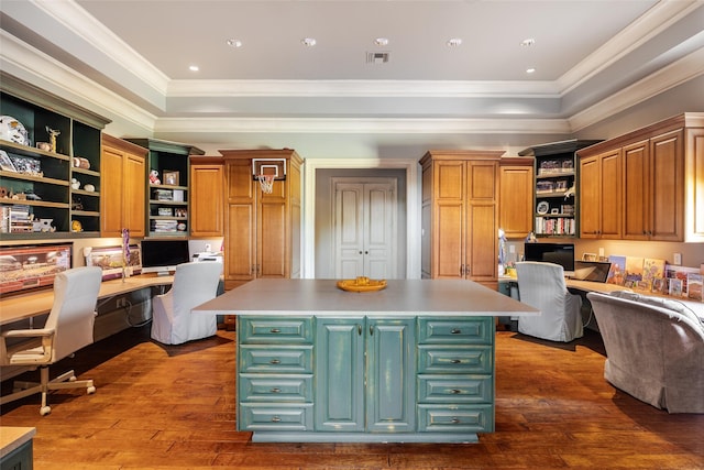 kitchen featuring visible vents, open shelves, built in desk, and a center island