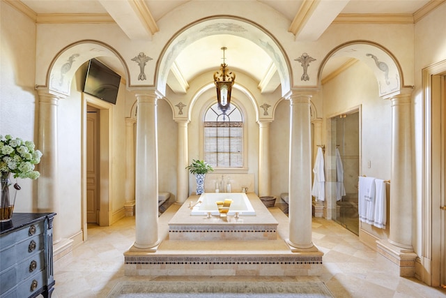 interior space with arched walkways, baseboards, lofted ceiling with beams, and ornate columns