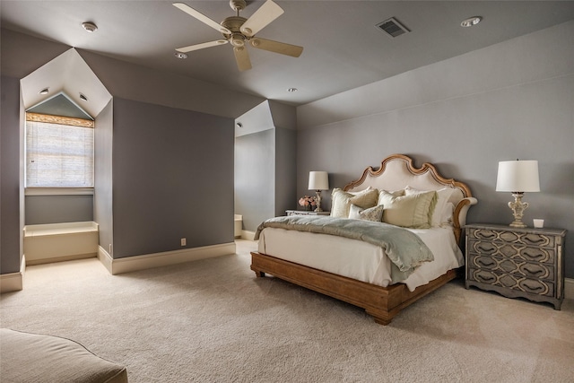 bedroom featuring lofted ceiling, baseboards, visible vents, and carpet flooring