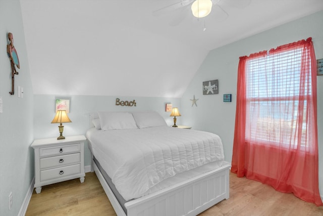 bedroom with lofted ceiling, baseboards, light wood-type flooring, and ceiling fan