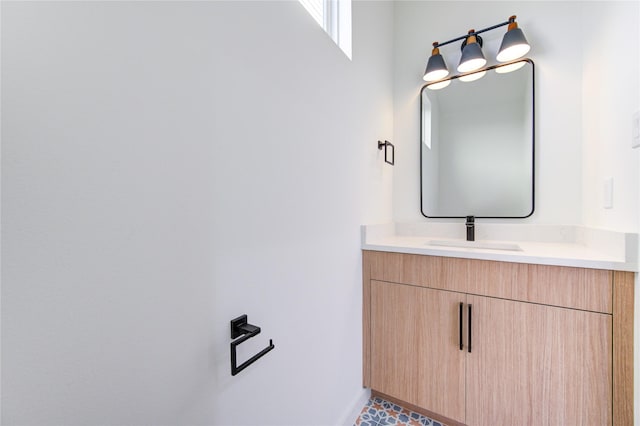 bathroom with baseboards and vanity