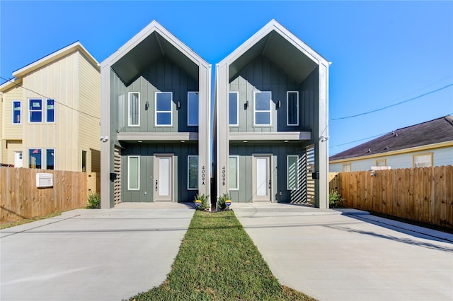 view of front of home featuring fence and board and batten siding