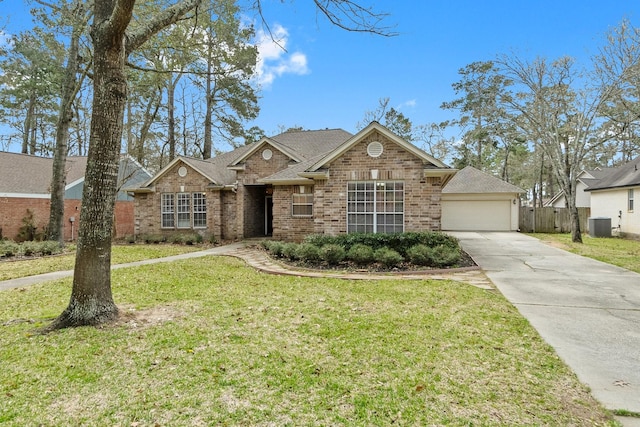 view of front of property featuring brick siding, a shingled roof, a front lawn, fence, and central AC unit