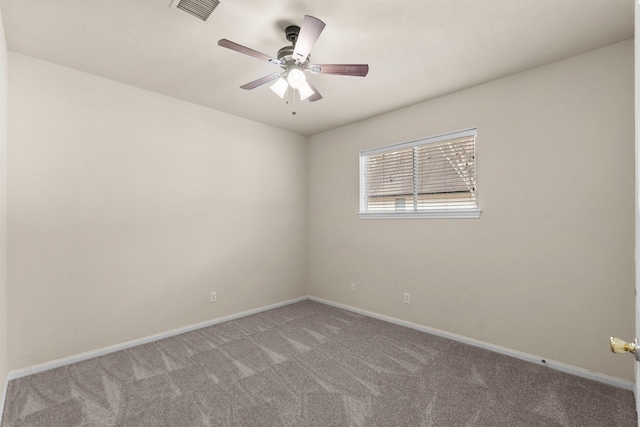 empty room featuring visible vents, light carpet, baseboards, and ceiling fan