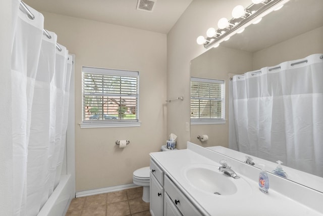 bathroom with tile patterned floors, visible vents, baseboards, and a healthy amount of sunlight