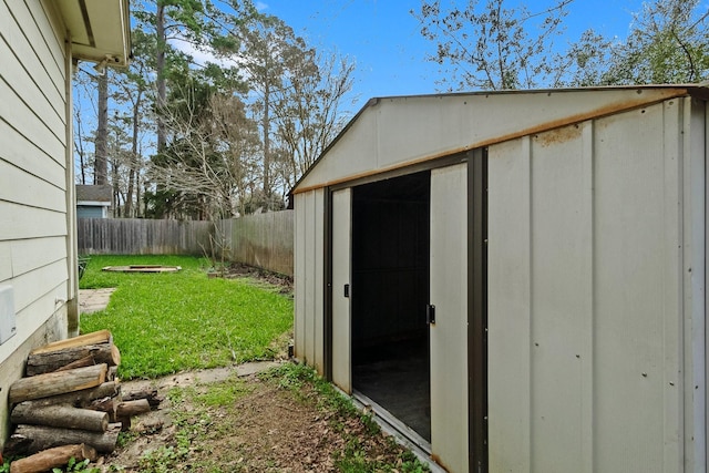 view of shed with a fenced backyard