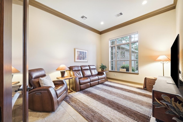 living room with ornamental molding, visible vents, baseboards, and light tile patterned flooring