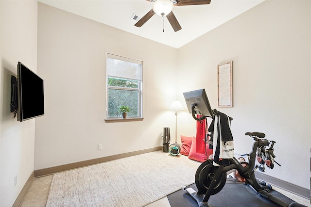 exercise room with a ceiling fan, visible vents, and baseboards