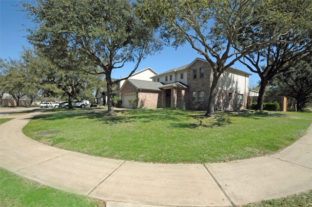 view of side of home with a garage, a lawn, and brick siding