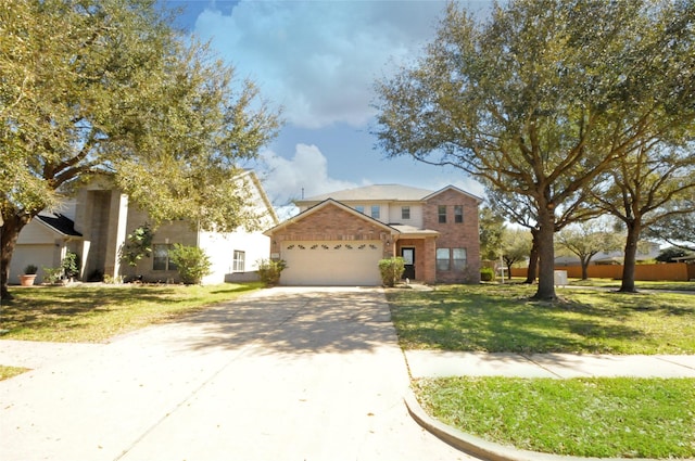 traditional-style house with a front lawn, brick siding, a garage, and driveway