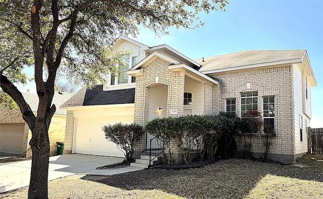 traditional-style home with driveway and brick siding