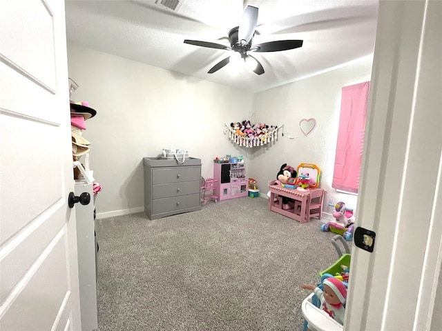 game room with carpet floors, visible vents, and a ceiling fan