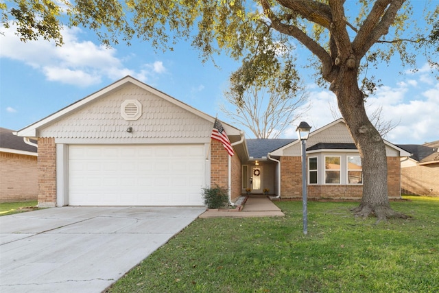 single story home featuring brick siding, a garage, driveway, and a front lawn