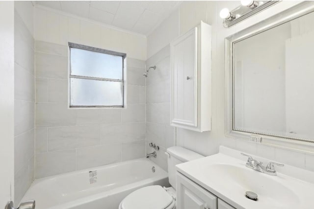 full bathroom featuring toilet, vanity, crown molding, and shower / bathtub combination