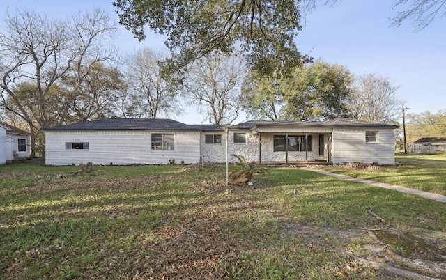 view of front of property featuring stone siding and a front lawn