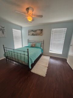 3506 Cove View Blvd Unit 1506, Galveston, TX 77554 - bedroom with baseboards, a ceiling fan, and wood finished floors