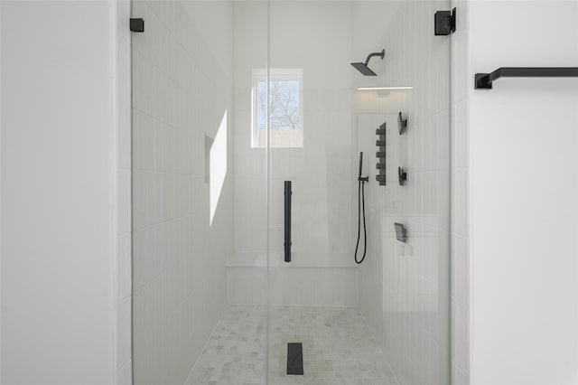 full bathroom featuring a shower stall