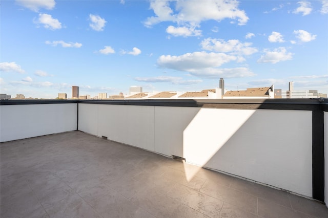 view of patio / terrace featuring a city view and a balcony