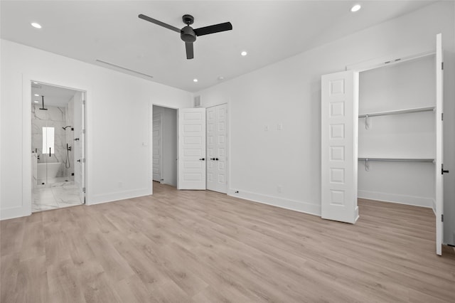 unfurnished bedroom with recessed lighting, visible vents, light wood-style floors, ensuite bath, and baseboards