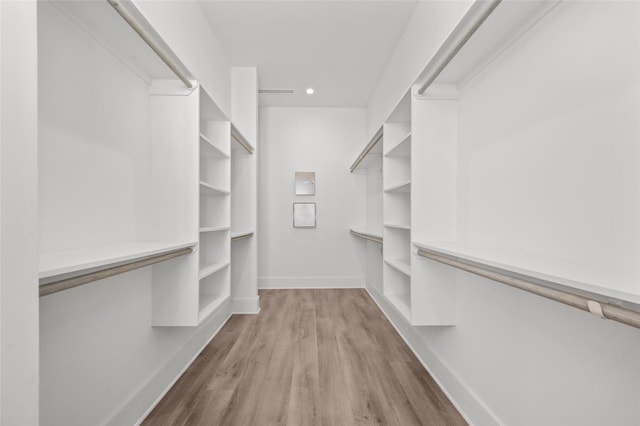 spacious closet featuring wood finished floors