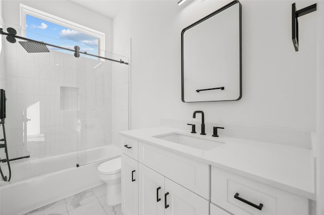 bathroom with marble finish floor, combined bath / shower with glass door, vanity, and toilet