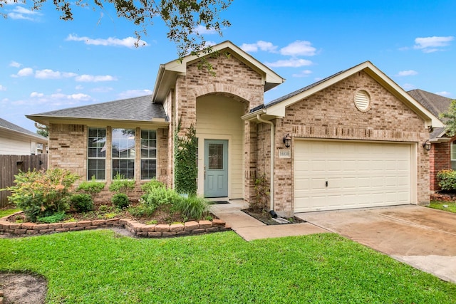 16830 Empty Ness Dr, Cypress, TX 77429 - view of front facade featuring brick siding, a garage, and concrete driveway