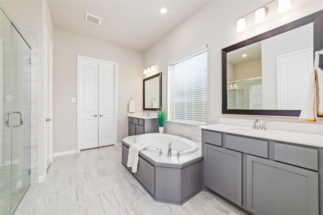 full bath featuring a sink, marble finish floor, a shower stall, and visible vents