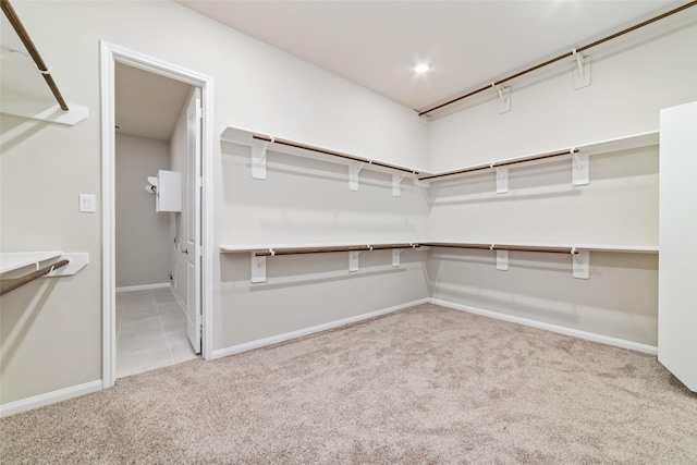 walk in closet featuring carpet