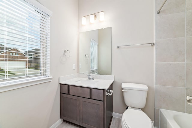 full bathroom featuring baseboards, vanity, toilet, and bathing tub / shower combination