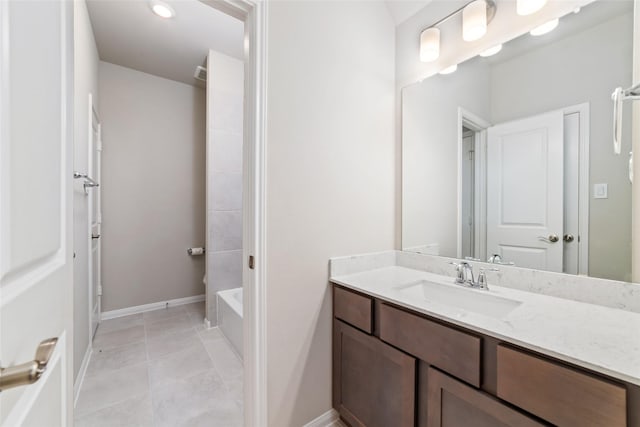 full bathroom with tile patterned flooring, vanity, and baseboards