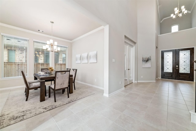 dining space with crown molding, a chandelier, french doors, and light tile patterned flooring