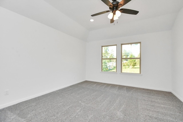 empty room with carpet, baseboards, vaulted ceiling, recessed lighting, and a ceiling fan