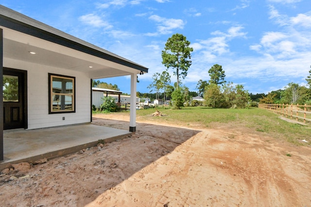 view of yard with a patio and fence