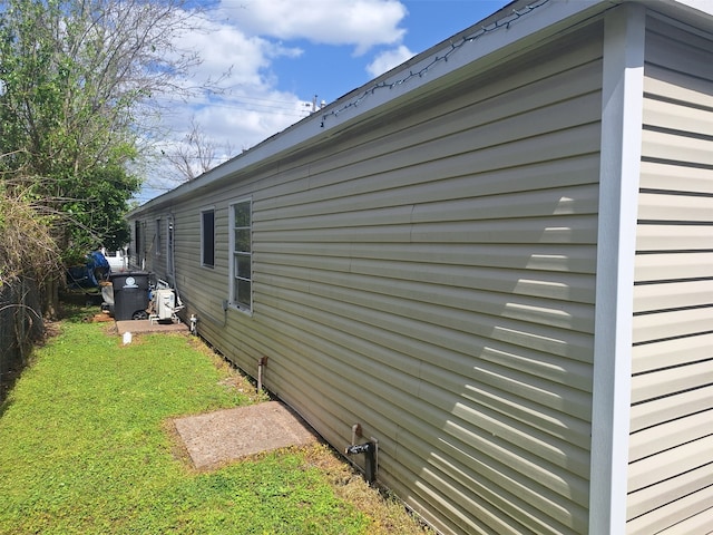 view of home's exterior with a yard