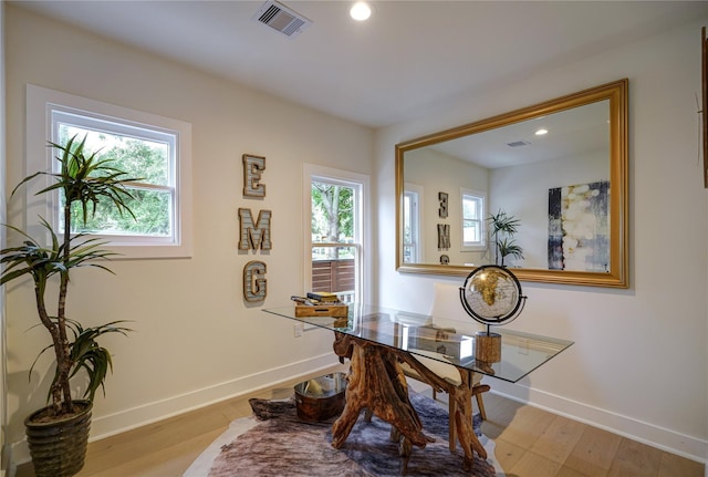 office area featuring light wood-style flooring, visible vents, baseboards, and recessed lighting