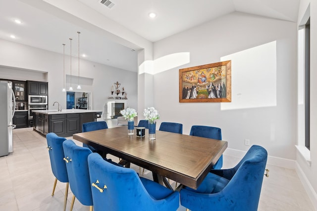 dining room featuring light tile patterned flooring, baseboards, visible vents, and recessed lighting